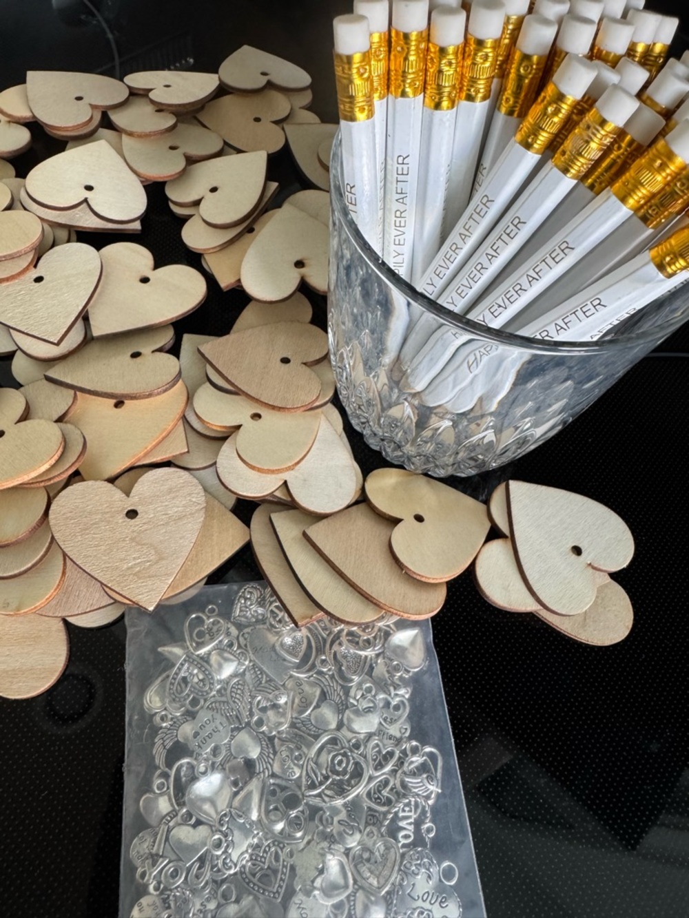 Happily Ever After pencils, heart, shaped wooden tags, and metal heart charms